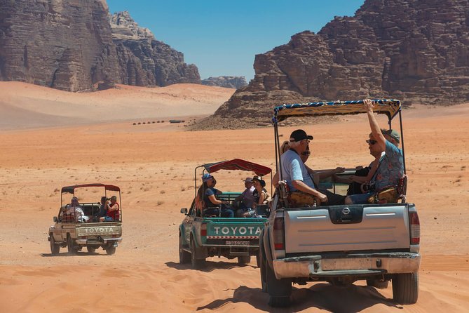 Best of Wadi Rum | Full day Jeep tour + Sleep under the stars | Pack all-in - Red sand dunes and broad desert views