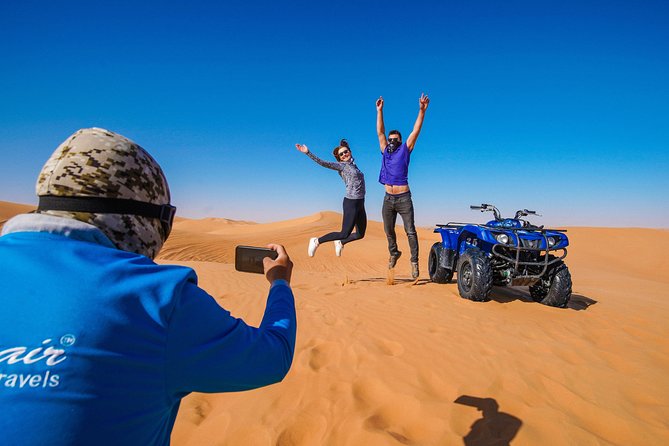 Dubai Red Dunes ATV, Camels, Stargazing & 5<em> BBQ Al Khayma Camp – At a glance’ /></p>
<ul>
<li><strong>Ride the red dunes of Lahbab:</strong> Spend about 60 minutes on an ATV after a safety briefing and helmet fitting.</li>
<li><strong>Sandboard and photograph the dunes:</strong> The ride includes a stop for sliding down the sand and taking pictures.</li>
<li><strong>Visit Al Khayma Camp:</strong> Enjoy Arabic coffee, dates, sweets, camel rides, henna, shisha, falcon photos, and local dress.</li>
<li><strong>Eat a full BBQ buffet:</strong> The evening meal includes vegetarian and non-vegetarian choices, live BBQ, bread, soft drinks, and water.</li>
<li><strong>Finish with entertainment and stars:</strong> Evening departures include Arabian shows, a fire performance, and stargazing.</li>
<li><strong>Expect a full half-day:</strong> Pickup begins before the selected departure time, and the total experience lasts about six hours.</li>
</ul>
<h2>From Dubai hotels to the red dunes</h2>
<p><img width="669" height="446" decoding="async" src=