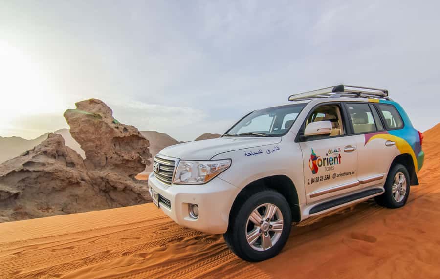 Mleiha Desert Safari with Sandboarding, Stargazing & Dinner - Sunset, photographs, and the Mleiha setting
